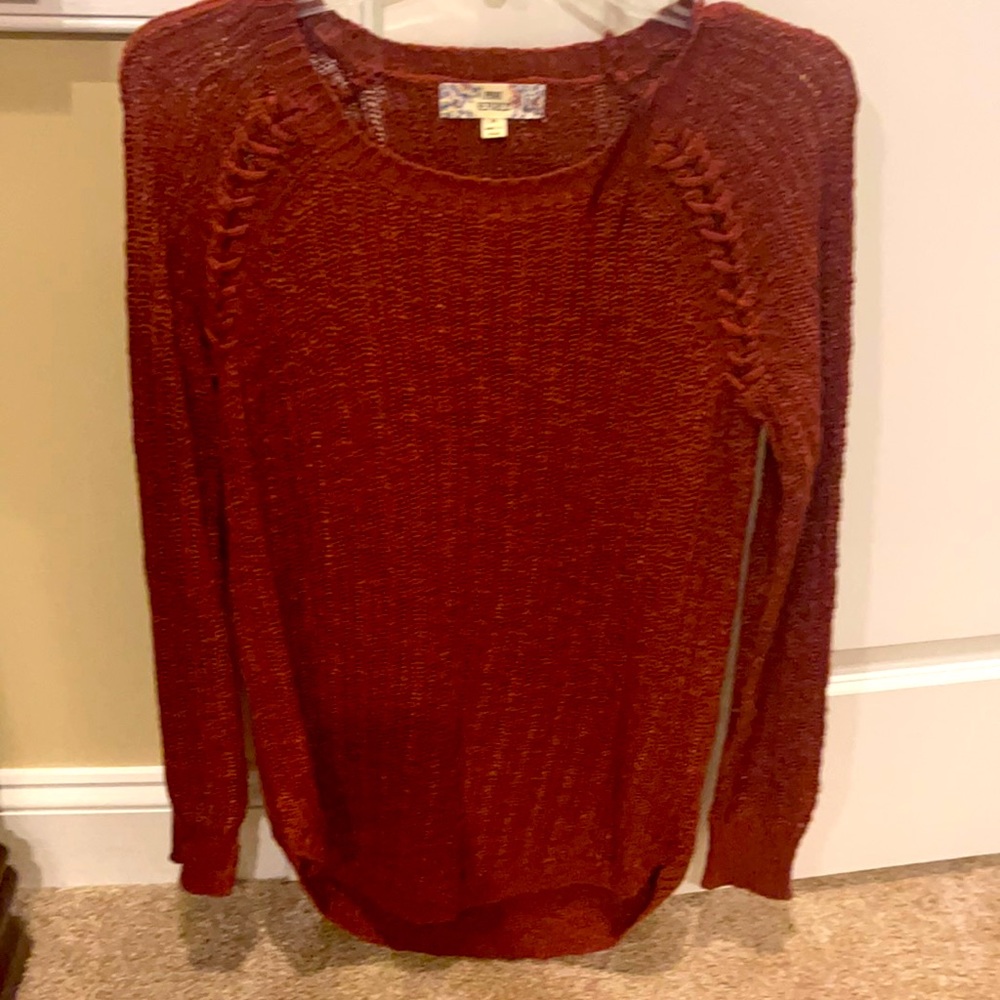 This is a burgundy sweater that is long sleeve. 85 %acrylic 15 percent cotton.